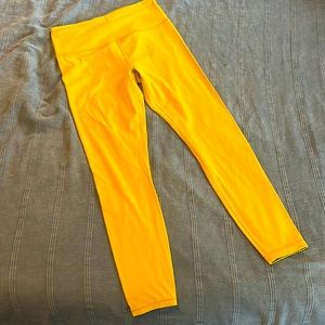 Athleta salutation legging mustard yellow color